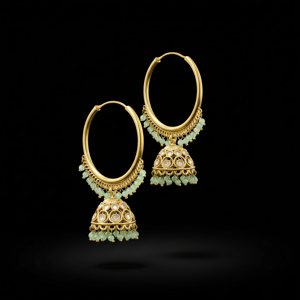 Gold hoop earrings with green beads on a gray stand with 'LOVE' branding.