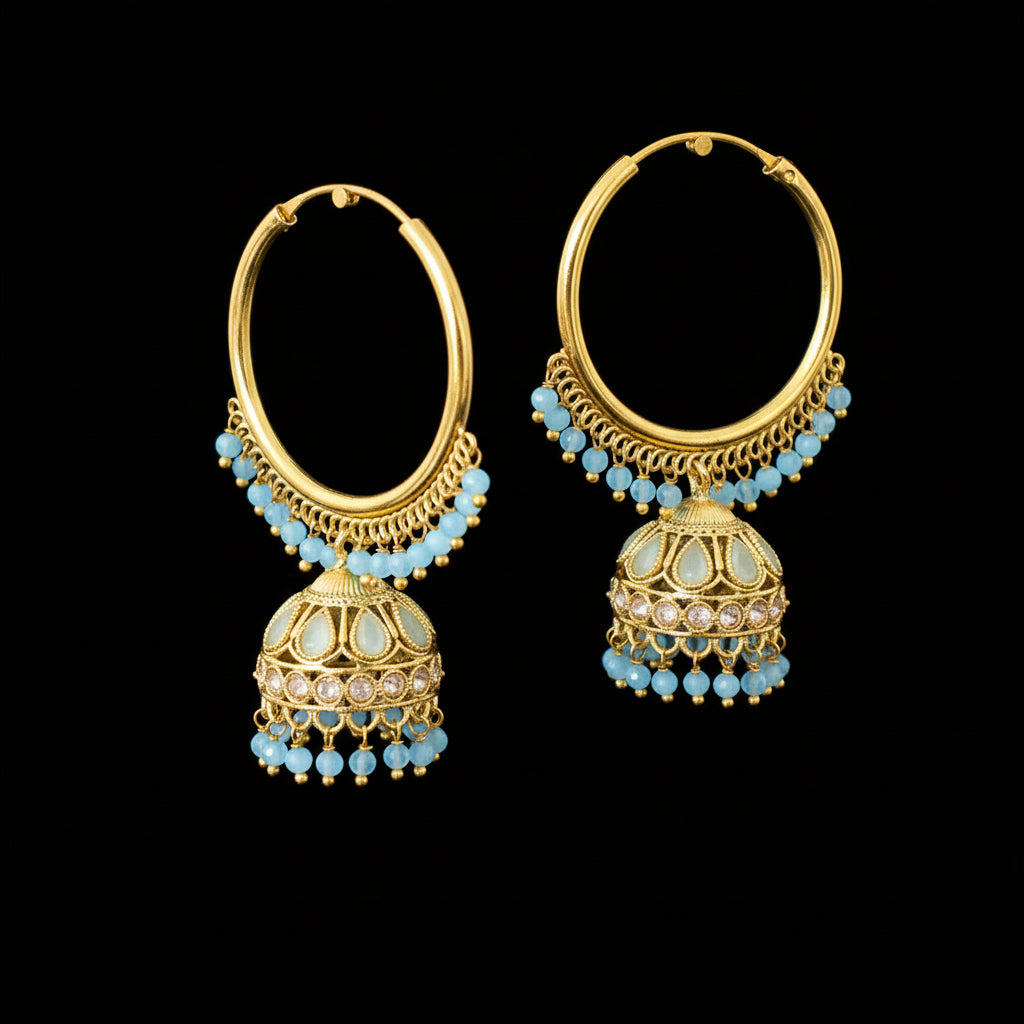 Gold hoop earrings with blue beads on a black background