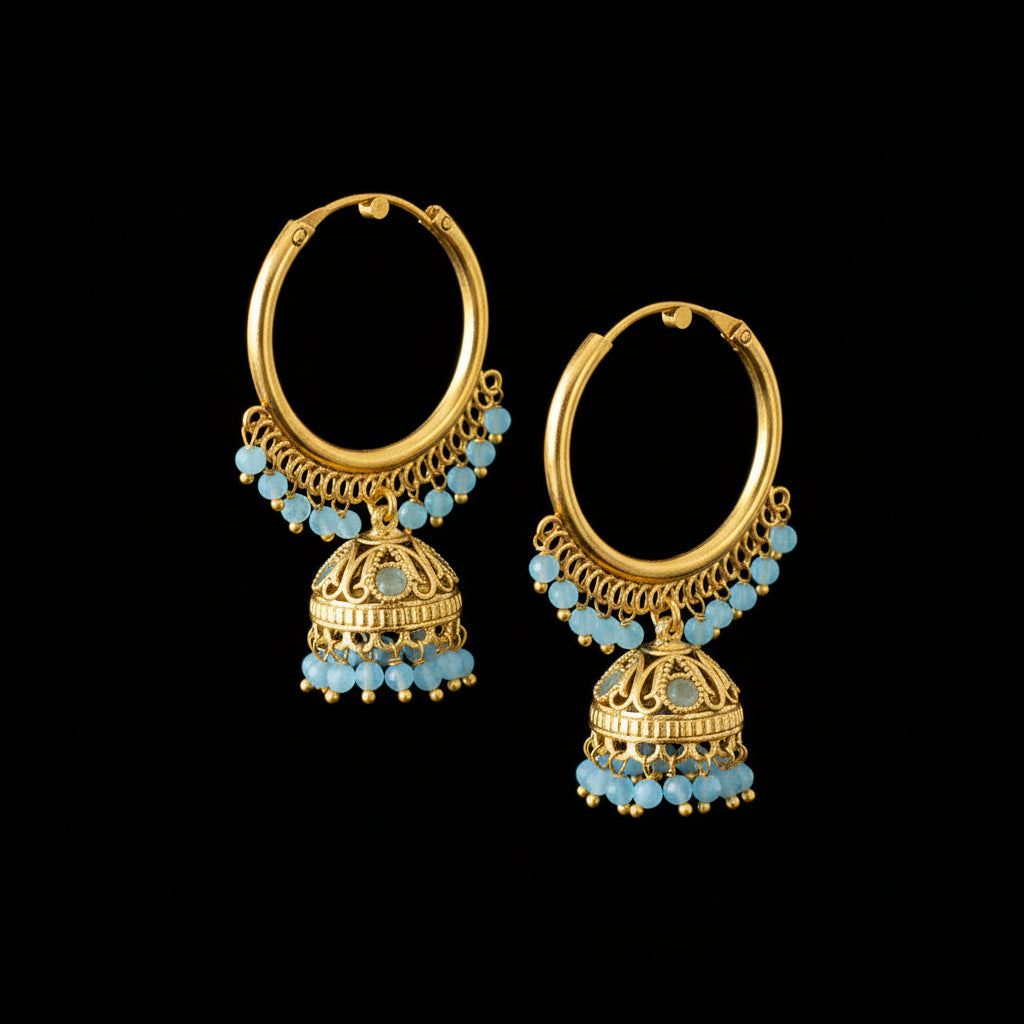 Gold hoop earrings with blue beads on a gray stand with Lenovo logo