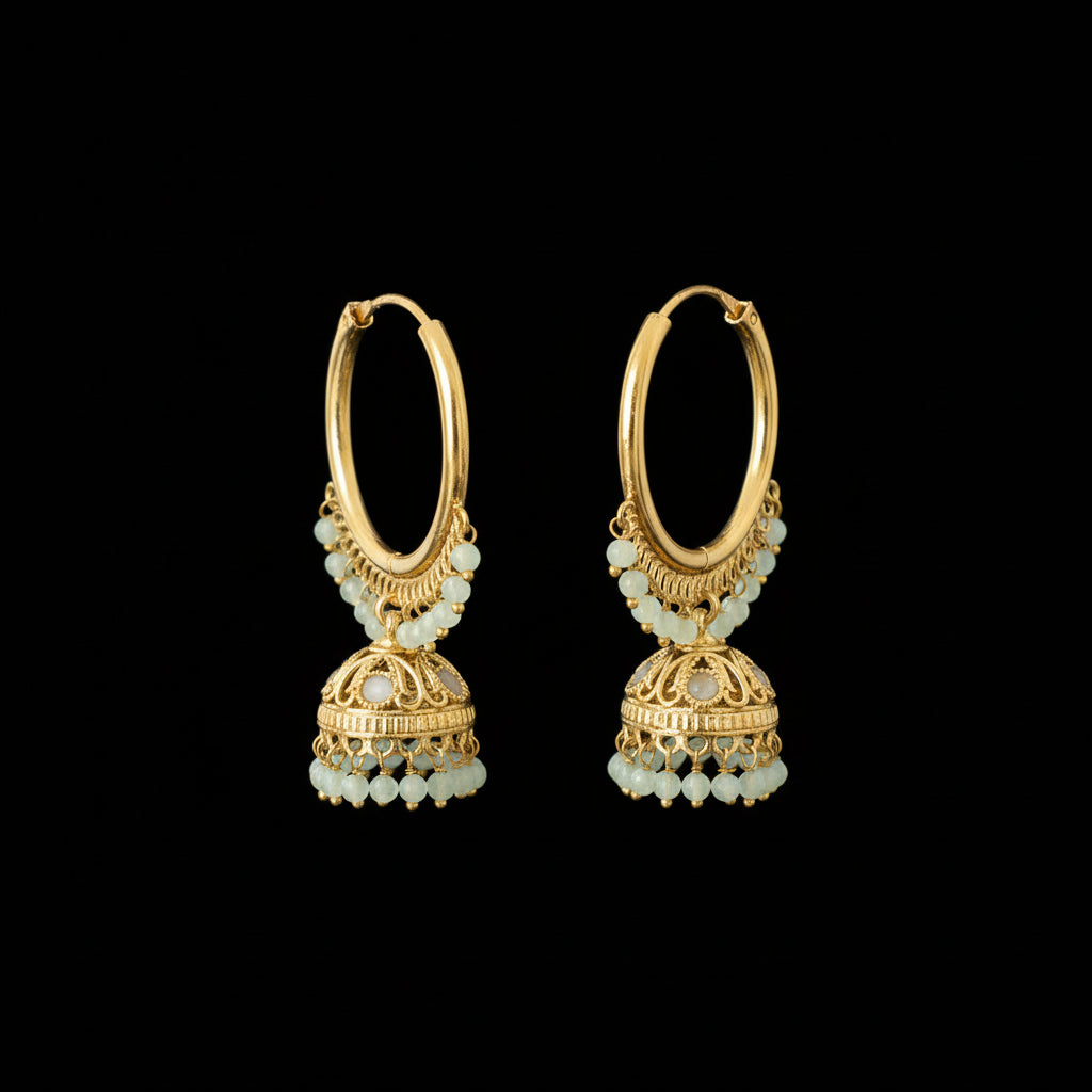 Gold hoop earrings with dangling charms on a Lenovo branded stand.
