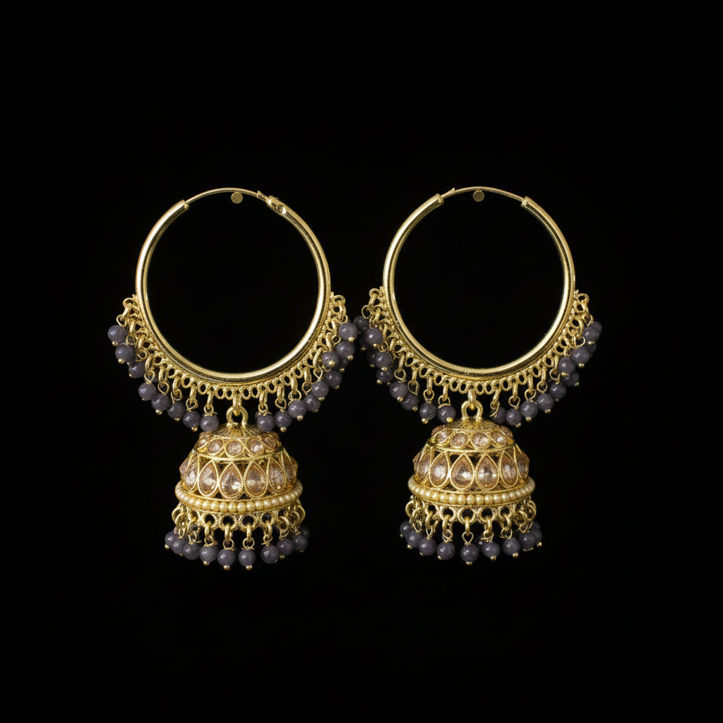 Gold and purple beaded earrings on a gray background with 'Saheli' branding.