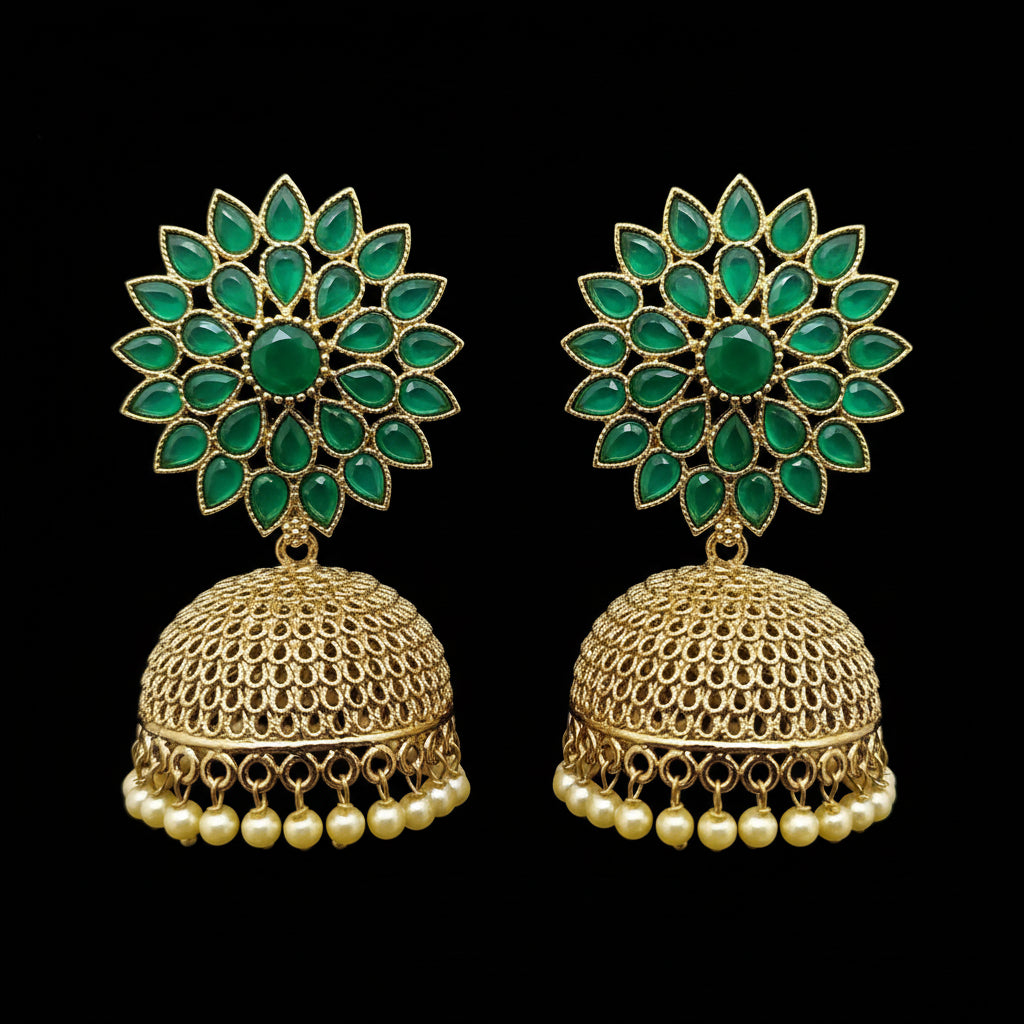 Gold and green floral earrings on a gray background
