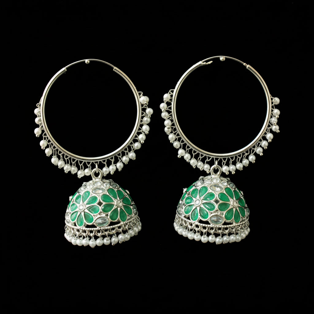 Pair of silver hoop earrings with green floral designs on a black background