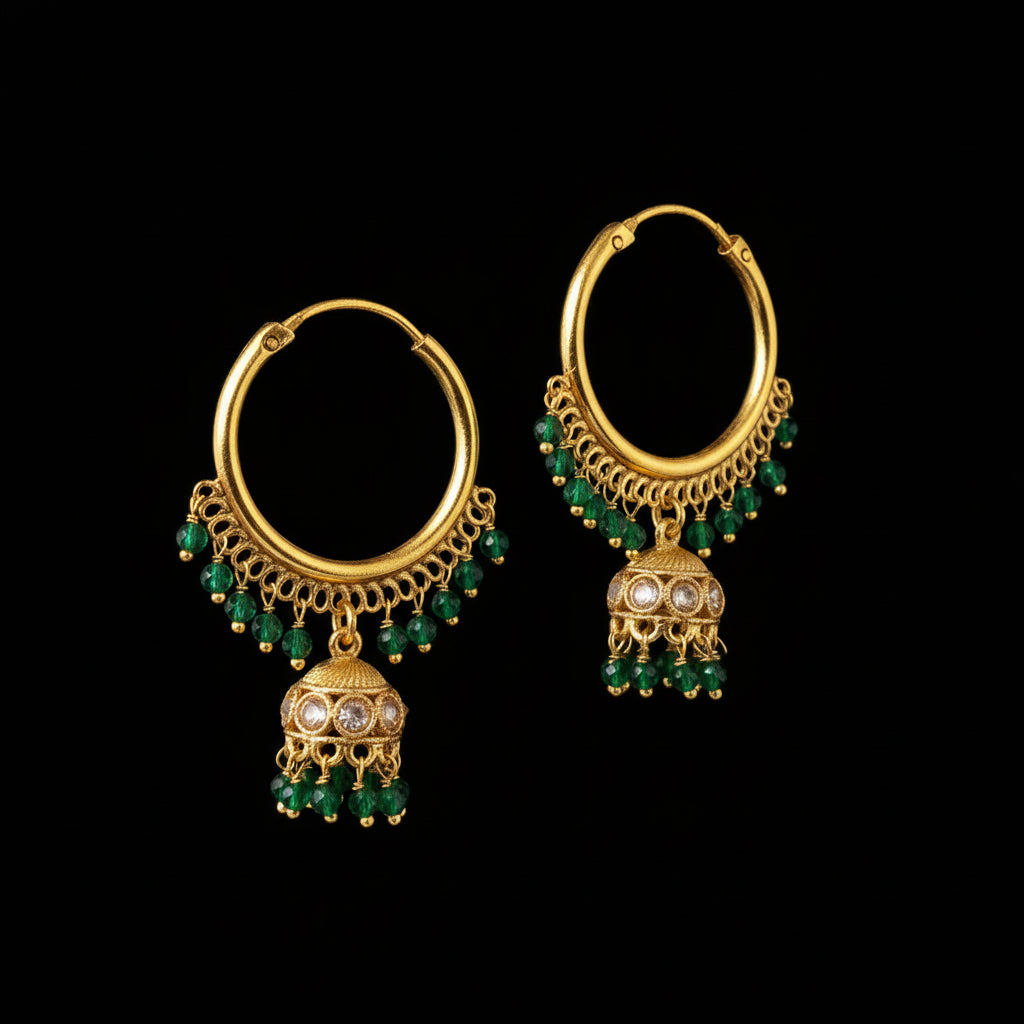 Gold hoop earrings with green gemstones on a gray background, featuring the brand 'Saheli'.