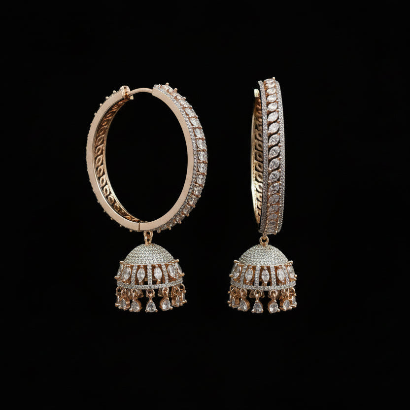 Pair of gold and diamond earrings on a black stand with HP logo in the background