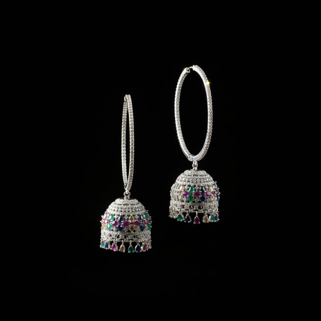 Silver earrings with gemstones on a black stand with HP logo in the background