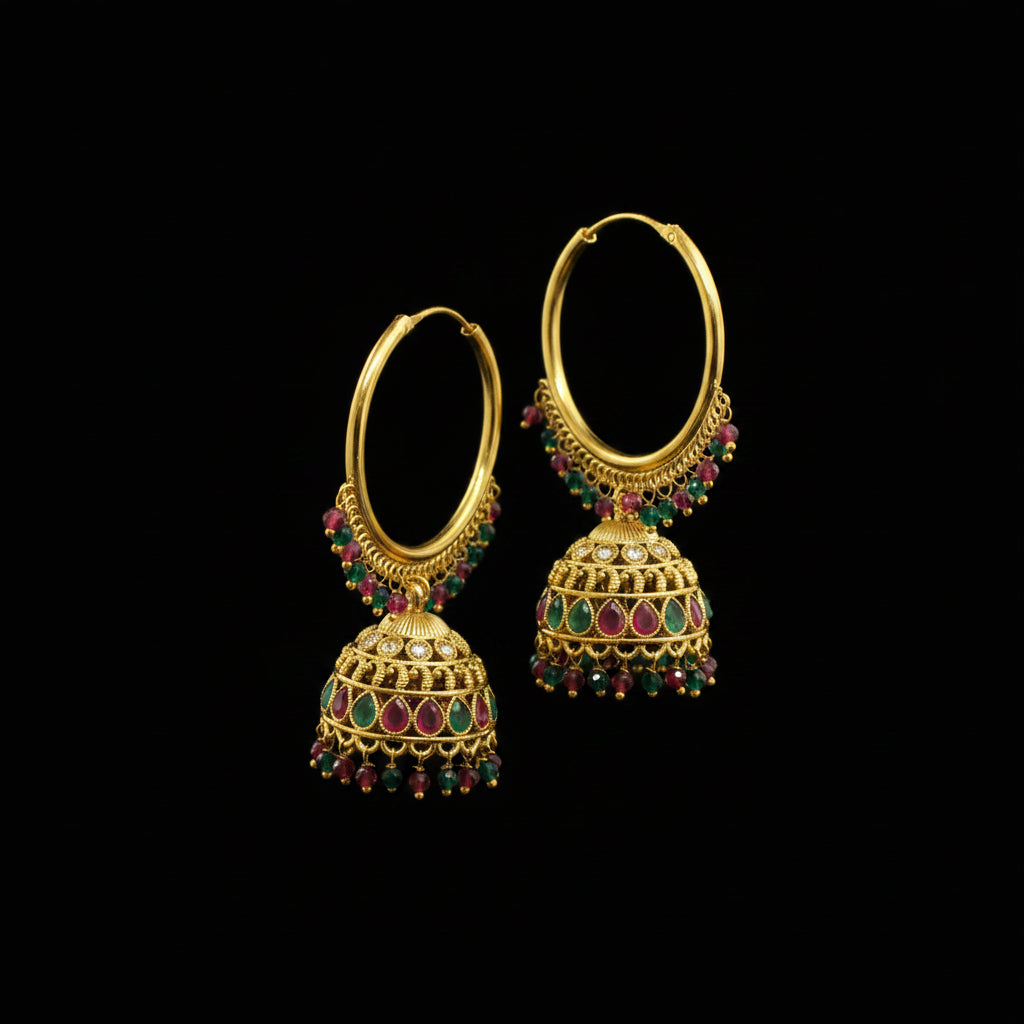 Gold hoop earrings with colorful beads on a gray background