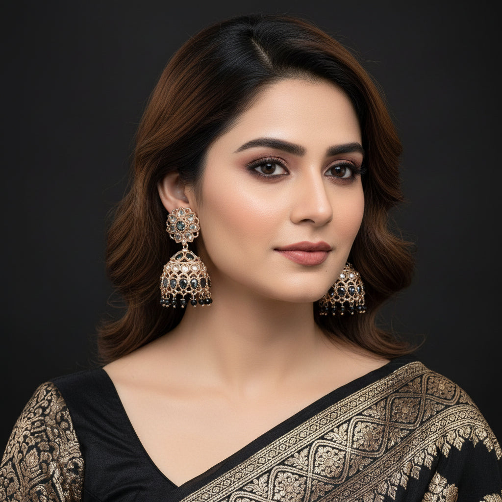 Pair of ornate earrings on a black background