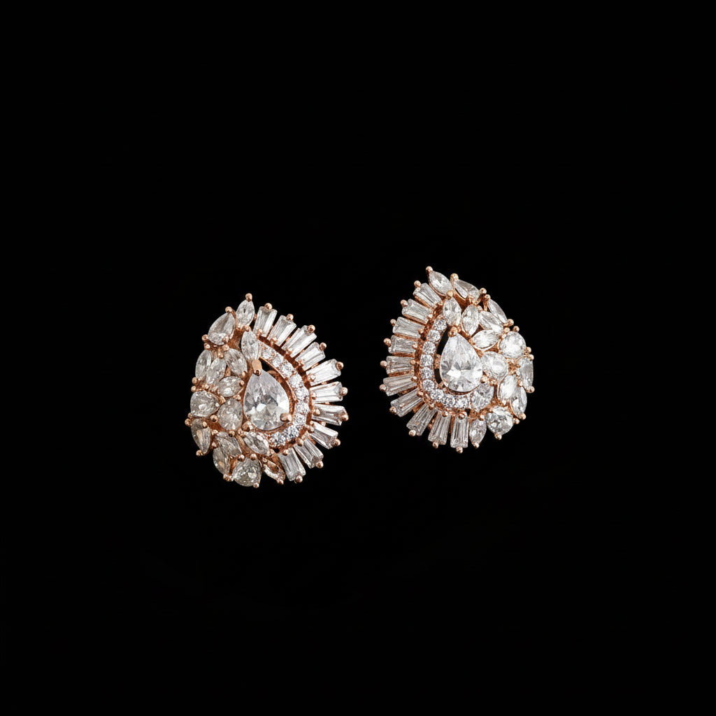 Pair of diamond earrings on a gray background with 'SAHELI' branding.