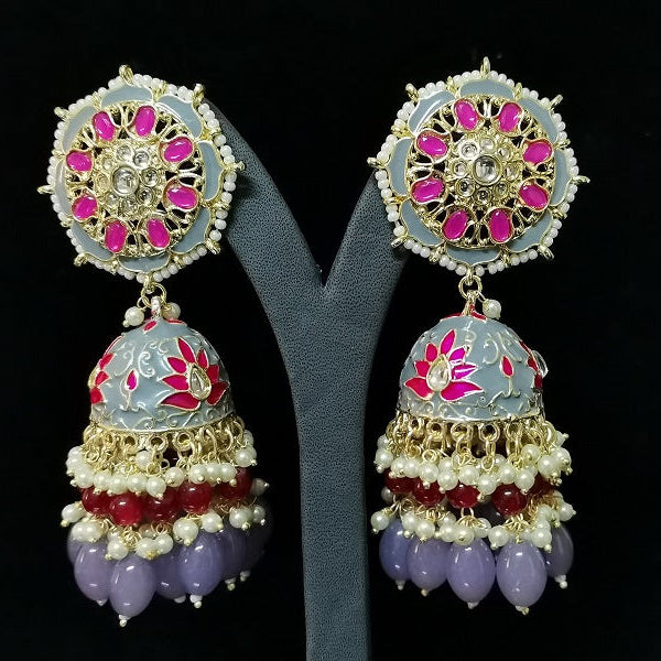 Ornate earrings with colorful beads and gemstones on a black background