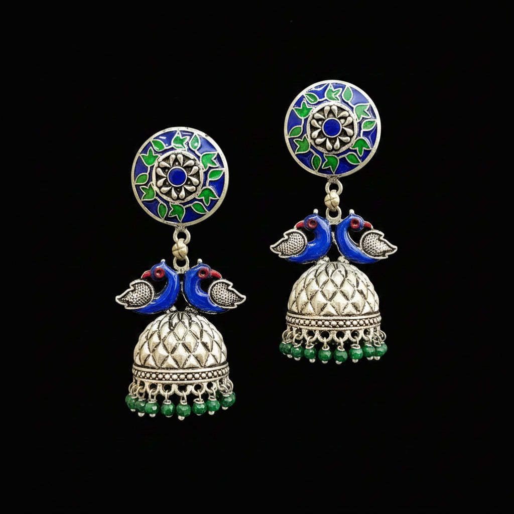 Decorative earrings on a gray stand with HP logo in the background