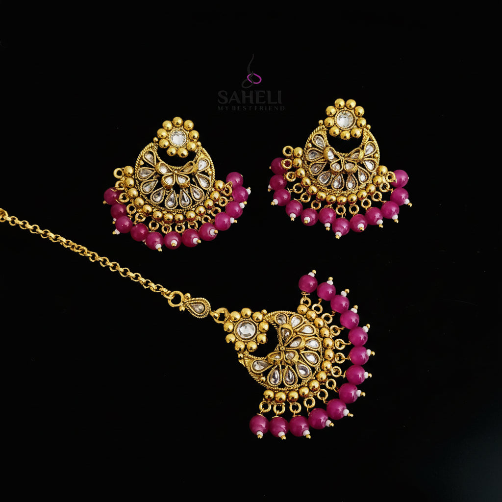 Gold and pink jewelry set on a dark background with 'SAHELI' branding.