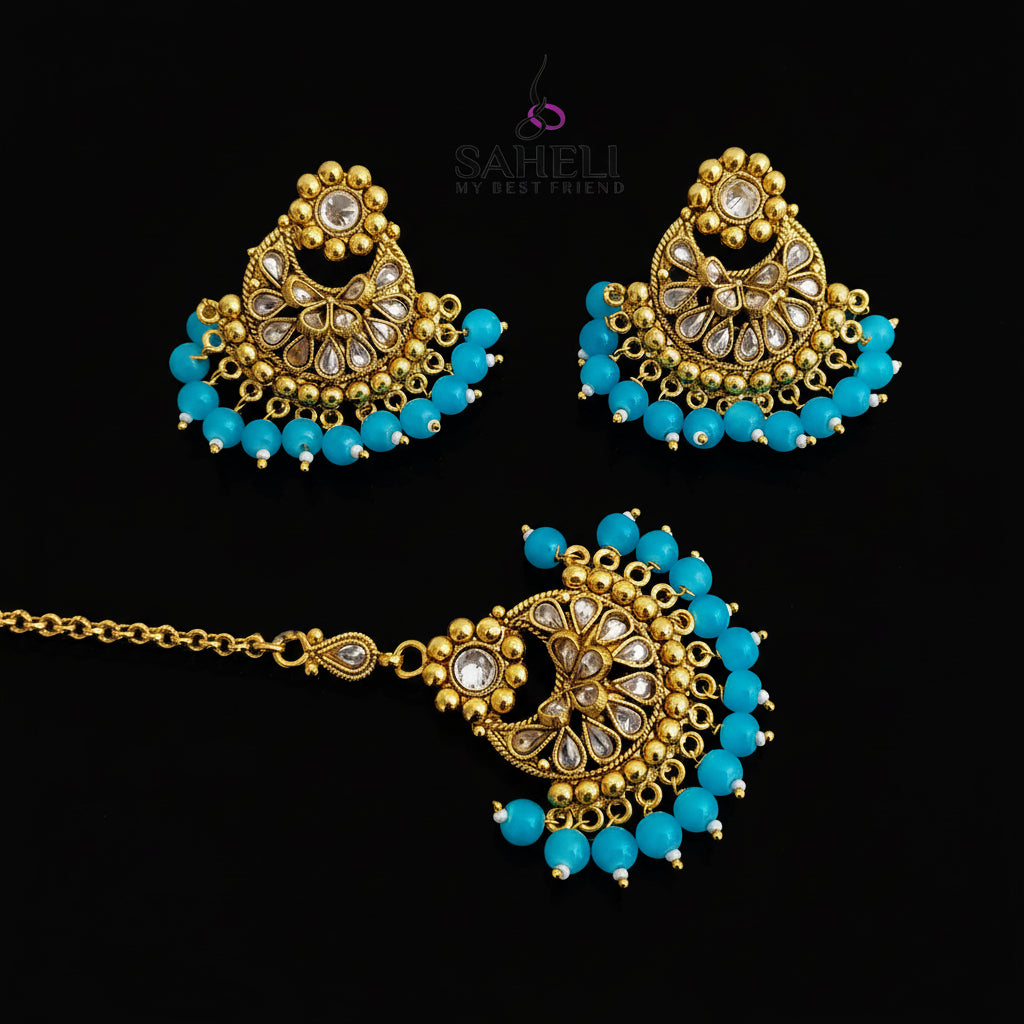 Ornate gold and turquoise jewelry set on a dark background with 'SAHELI' branding.
