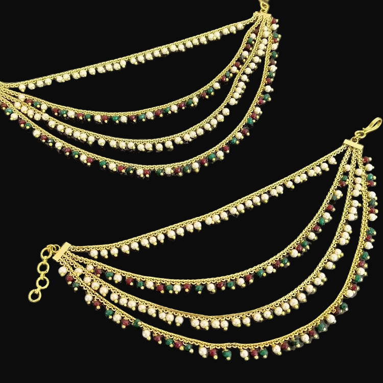 Gold anklets with beads on a gray background, featuring the brand 'Saheli'.