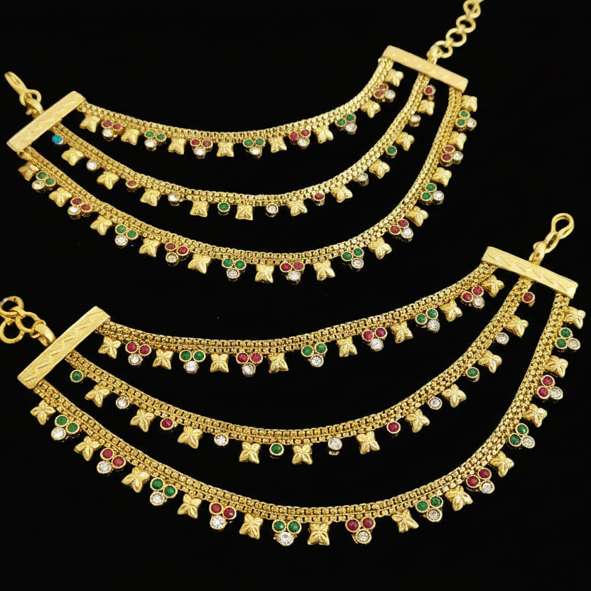 Two gold necklaces with gemstones on a dark background, branded 'SAHELL'.