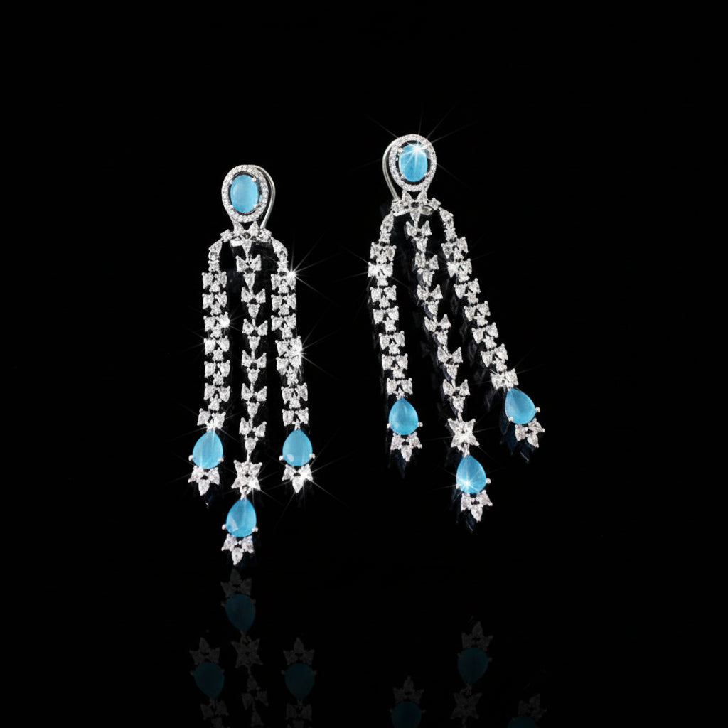 Pair of earrings with turquoise stones on a dark background
