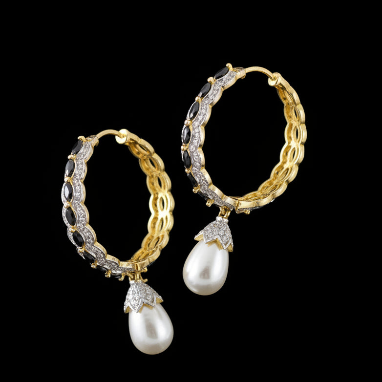 Gold and pearl earrings on a dark background with 'SAHELI' branding.