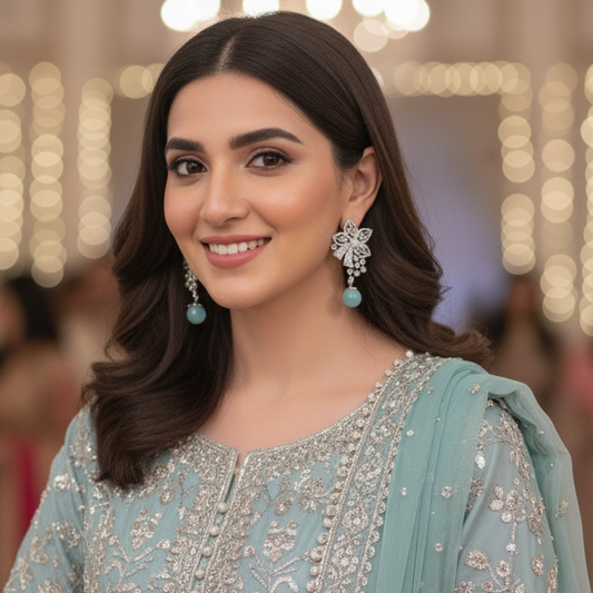 Woman in traditional attire with blurred background of people and lights