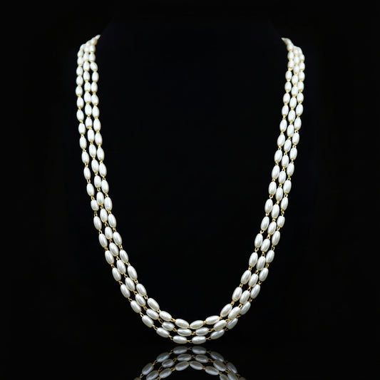 Pearl necklace on a black background