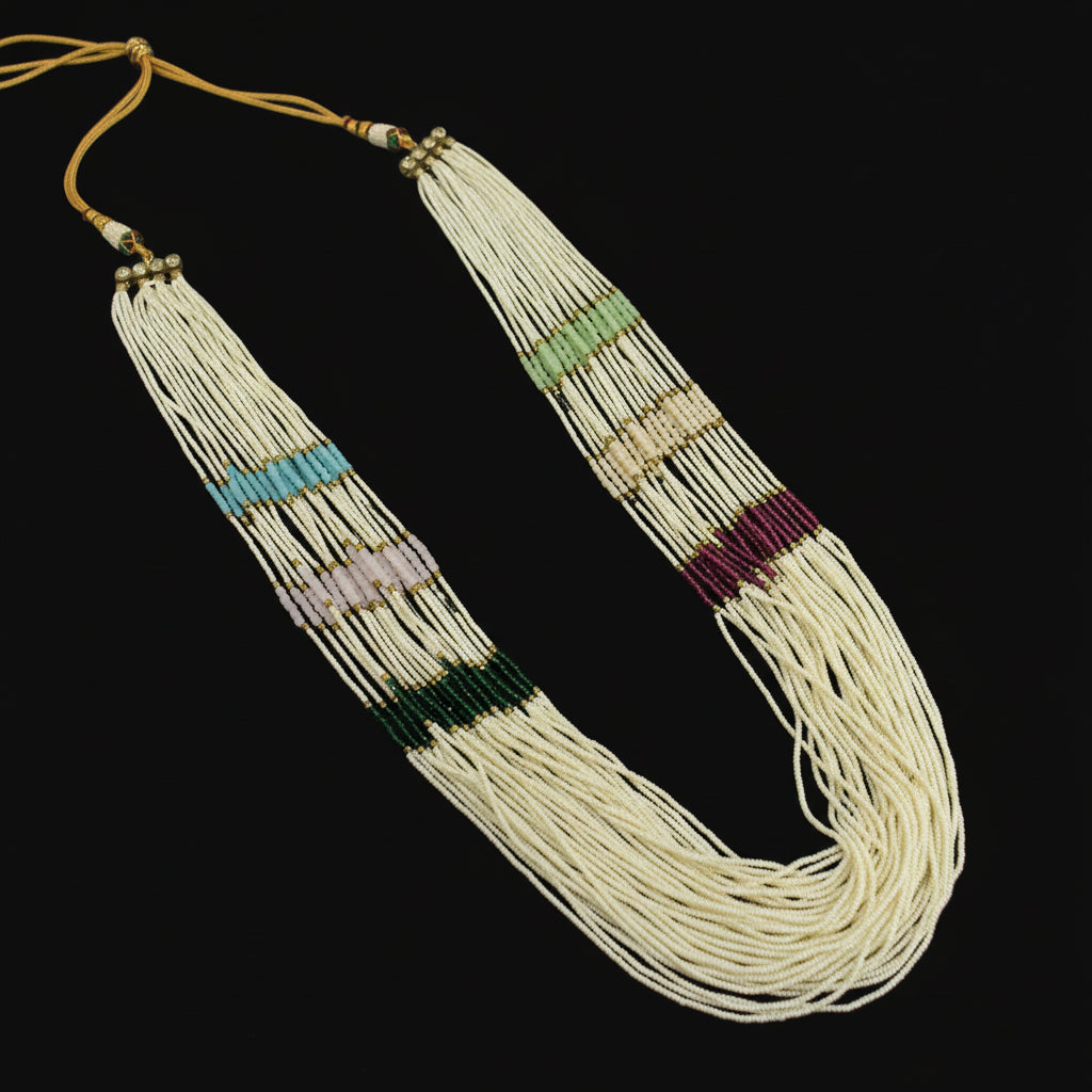 Beaded necklace with colorful accents on a dark background