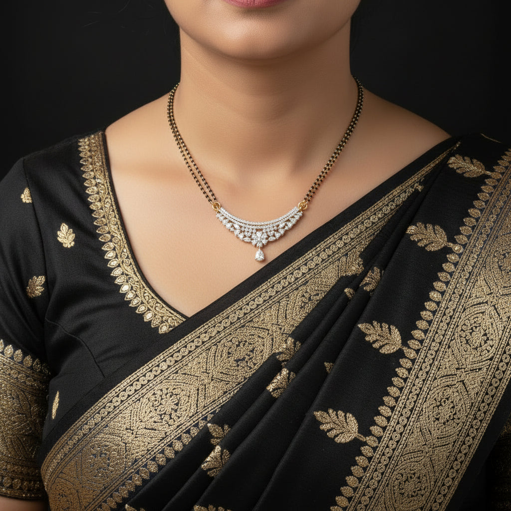 A silver-toned crescent moon pendant necklace with clear stones and gold accents, displayed on a black background.