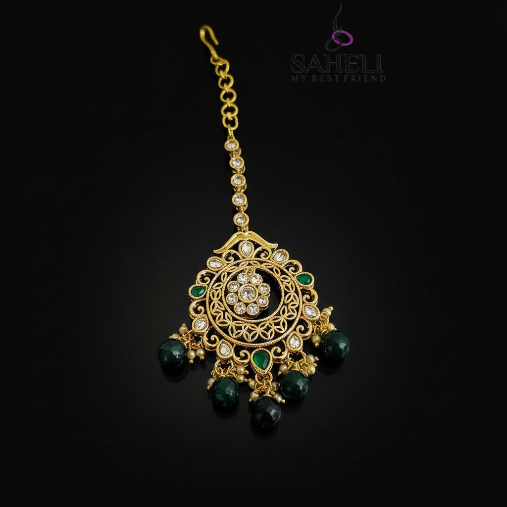 Gold and green decorative hair accessory with 'Saheli' branding on a dark background