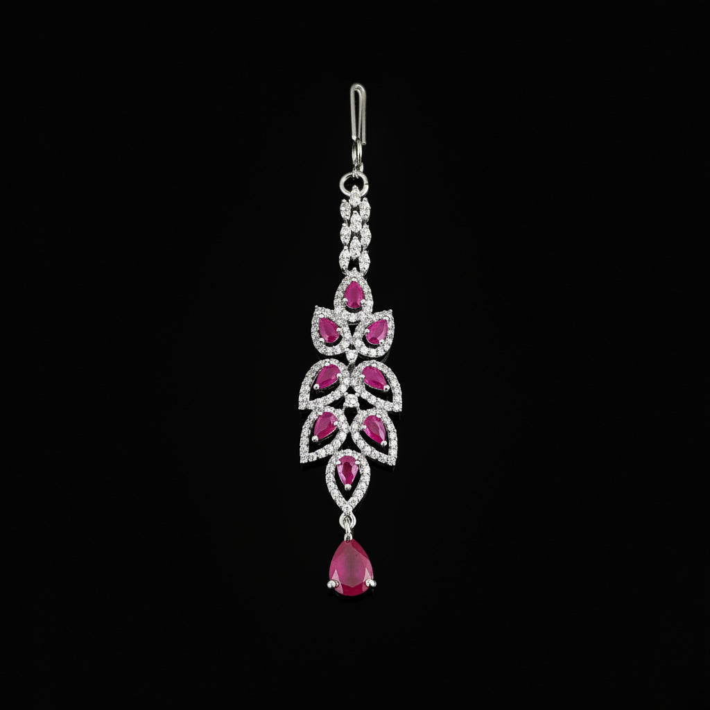Silver pendant with pink gemstones on a gray background, featuring the brand 'Saheli'.