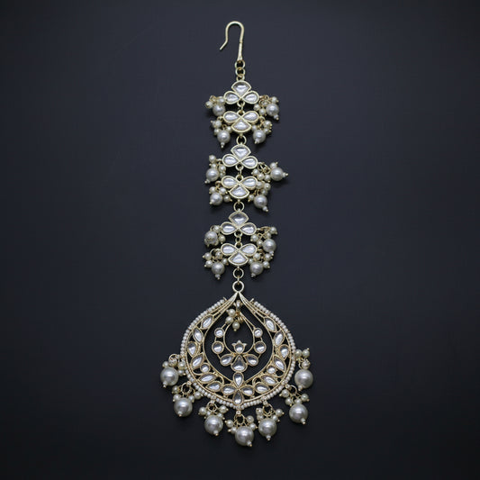 Ornate necklace with pearls on a dark background