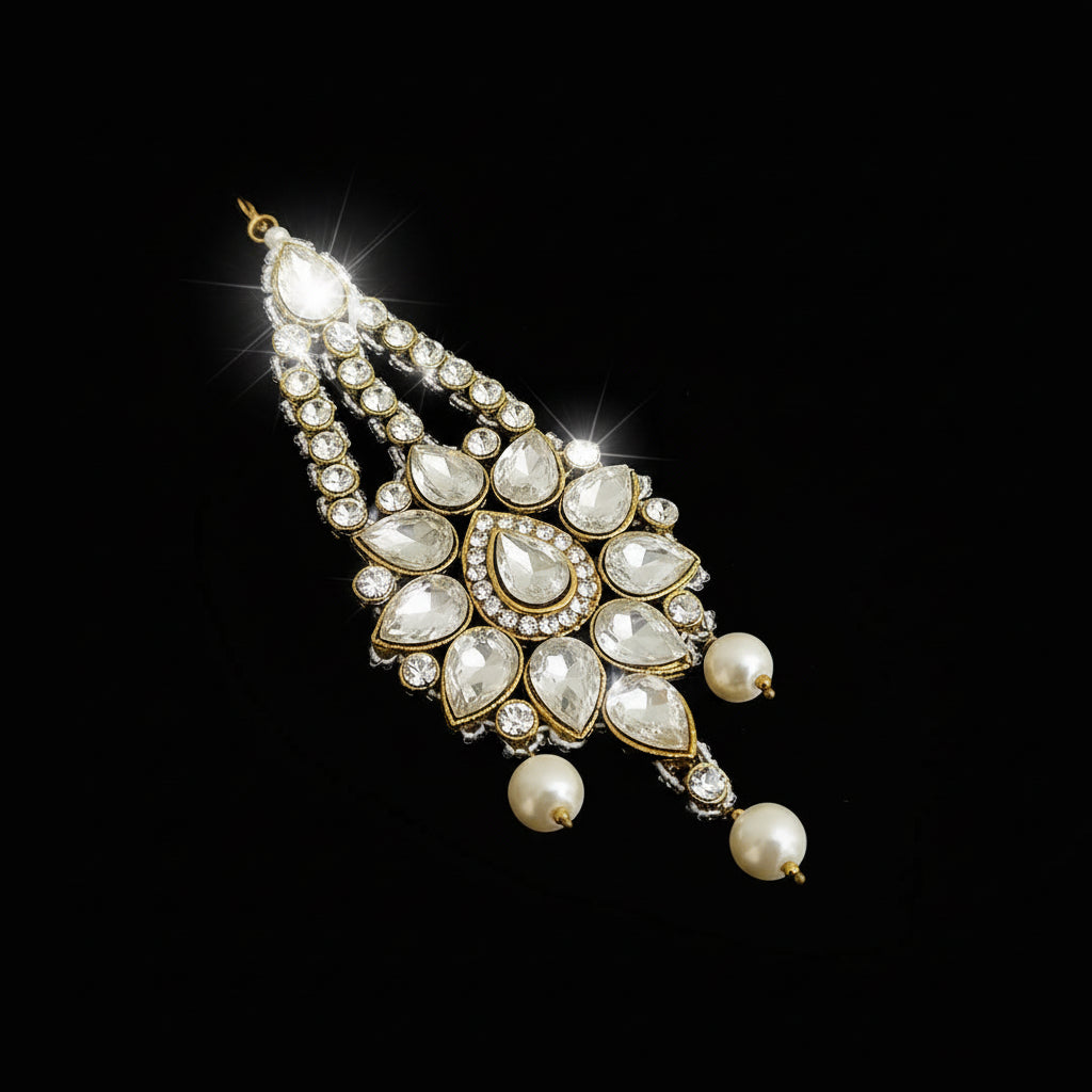 Jewelry pendant with pearls and crystals on a dark background, featuring the brand 'Saheli'.