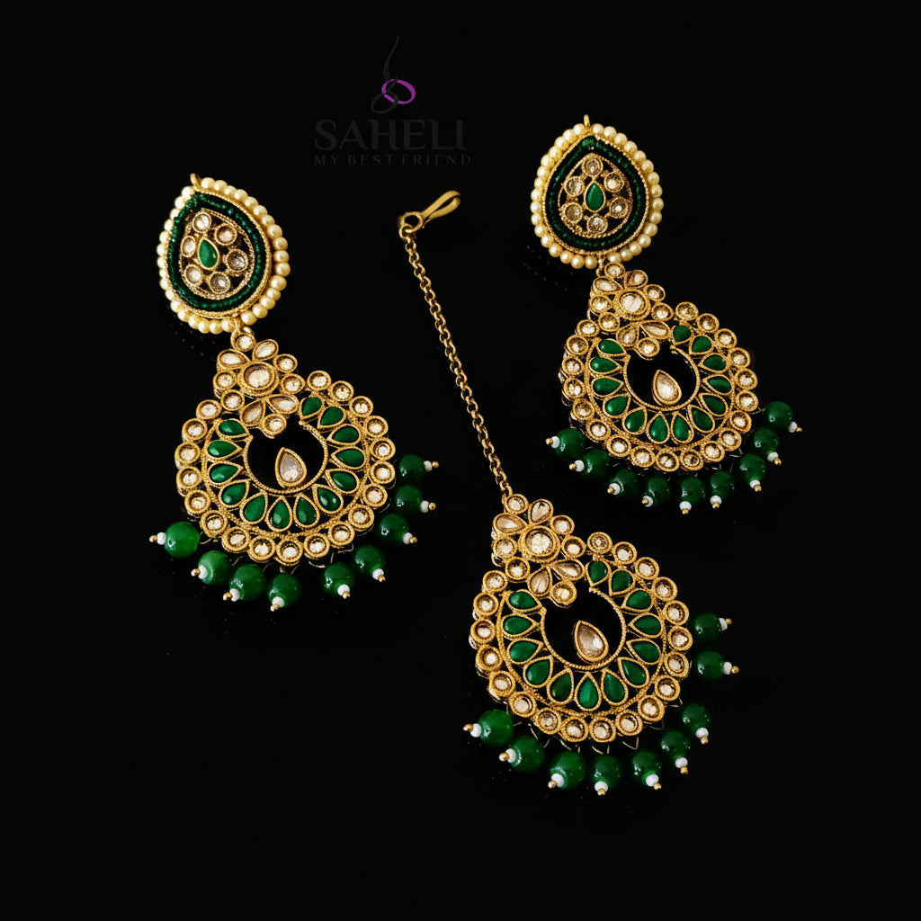 Gold and green earrings on a dark background with 'Saheli' branding.