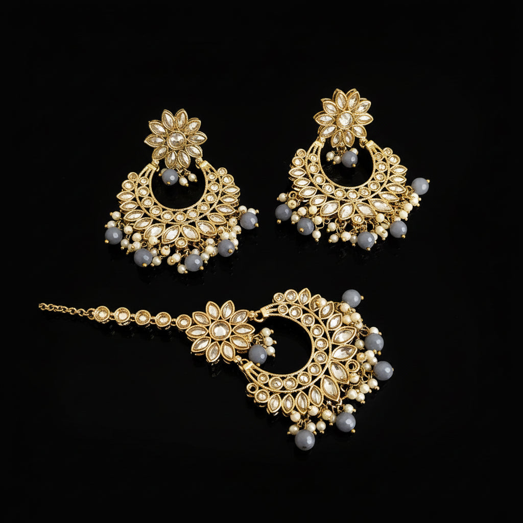 Ornate gold and gemstone jewelry set on a dark background with 'Saheli' branding.