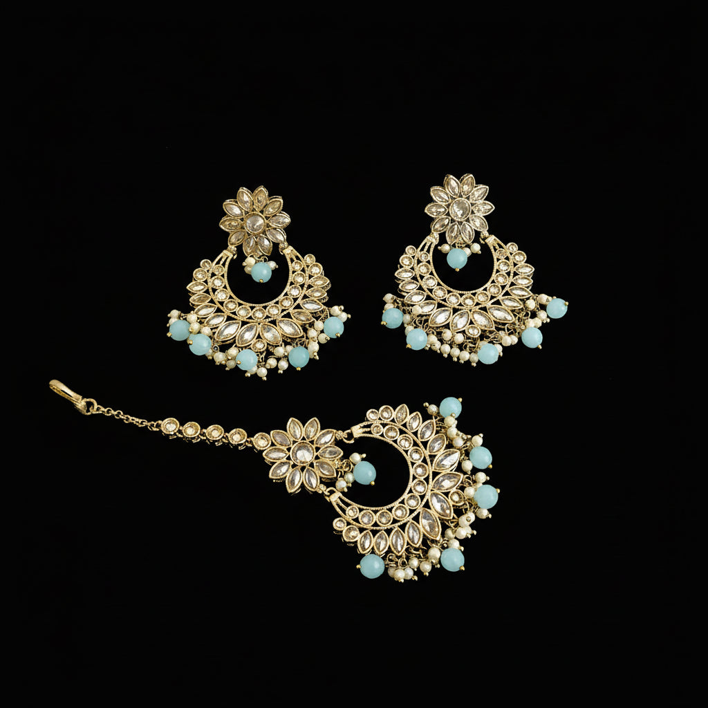 Ornate gold and turquoise jewelry set on a dark background with 'SAHELI' branding.