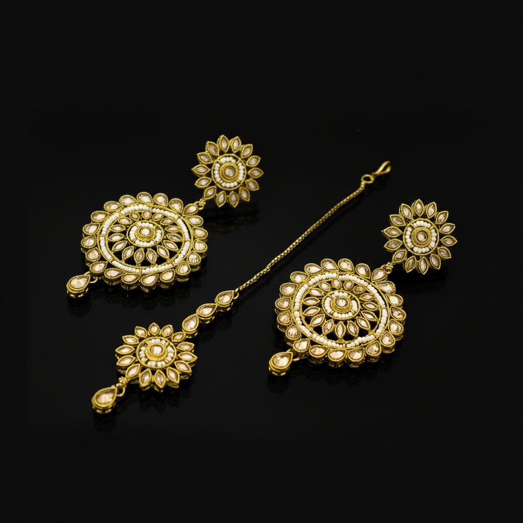 Gold jewelry set with floral designs on a dark background, featuring the brand 'Saheli'.