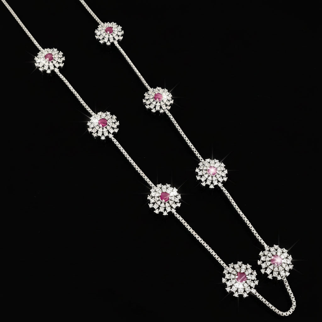 Silver necklace with pink gemstones on a gray background, featuring the brand 'SAHELL'.