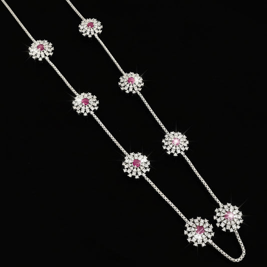 Silver necklace with pink gemstones on a gray background, featuring the brand 'SAHELL'.