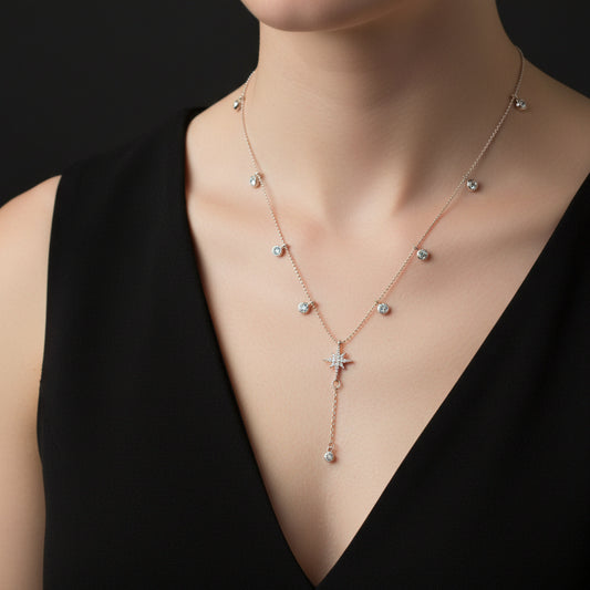 Delicate necklace with star-shaped pendant on a dark background