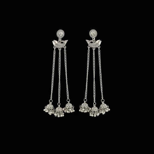 Silver earrings with chain and bead details on a gray background, branded 'SAHELI'.