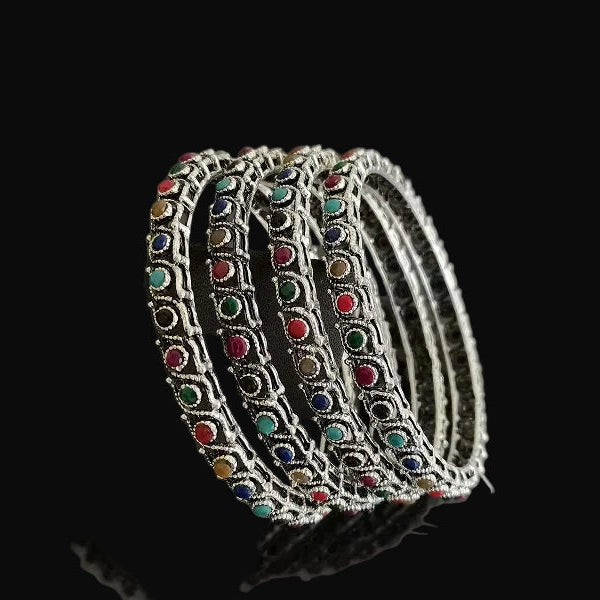 Set of colorful beaded bracelets on a dark background