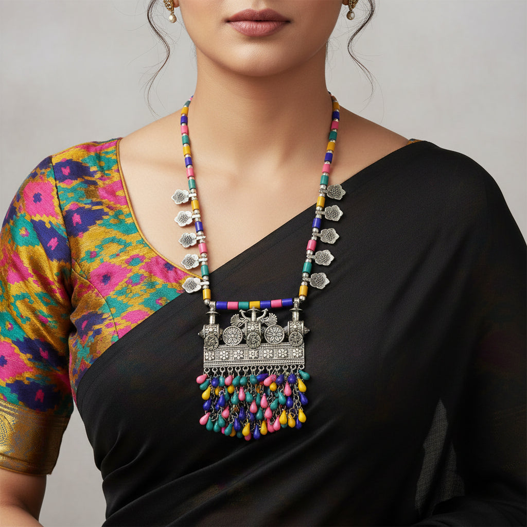 Colorful beaded necklace with intricate metalwork on a dark background