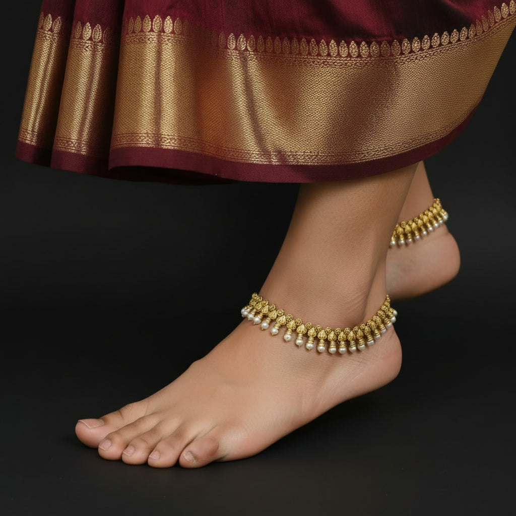 Gold and white beaded necklace on a dark background with 'SAHELI' branding.