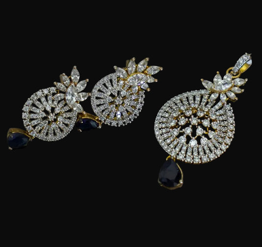 Pair of diamond earrings with black stones on a dark background