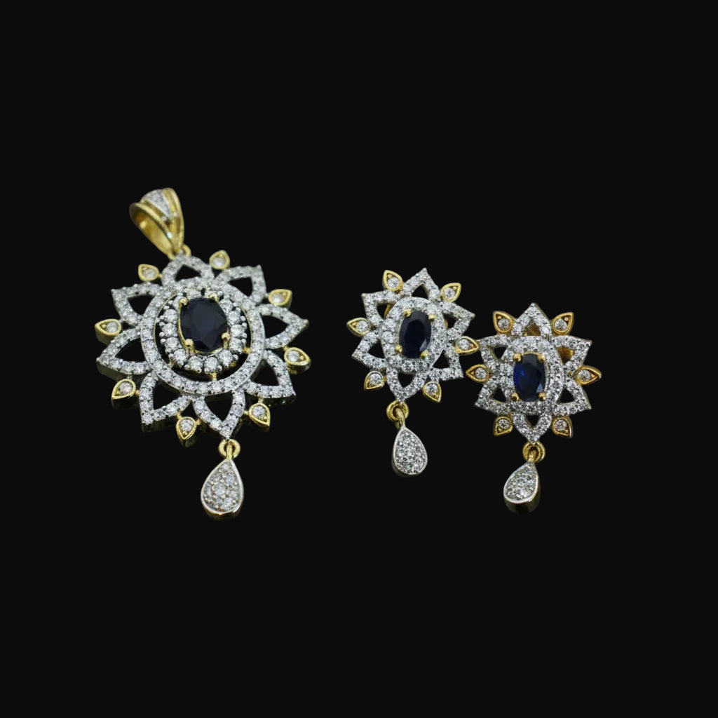 Pair of diamond earrings with gold accents on a dark background, branded 'Saheli'.