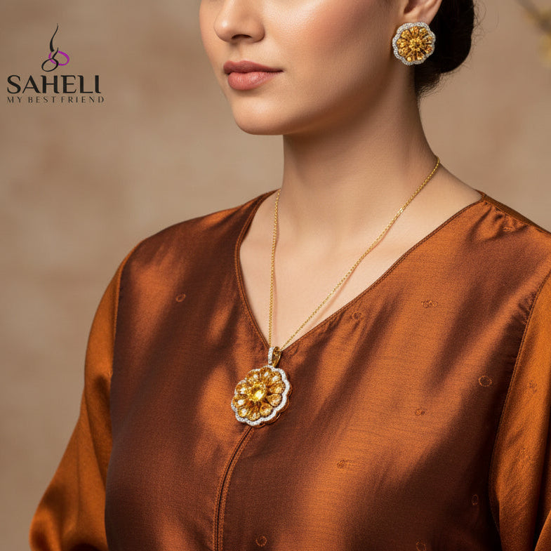 Gold and diamond earrings with 'SAHELI' branding on a dark background