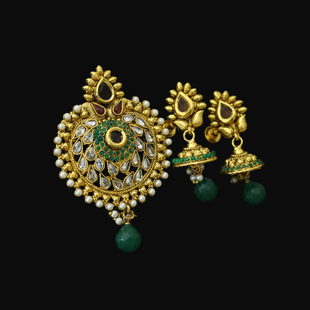 Gold and green earrings with 'Saheli' branding on a dark background