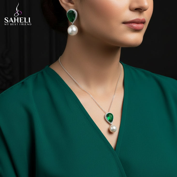 Jewelry set with necklace and earrings on a black background, featuring the brand 'Saheli'.