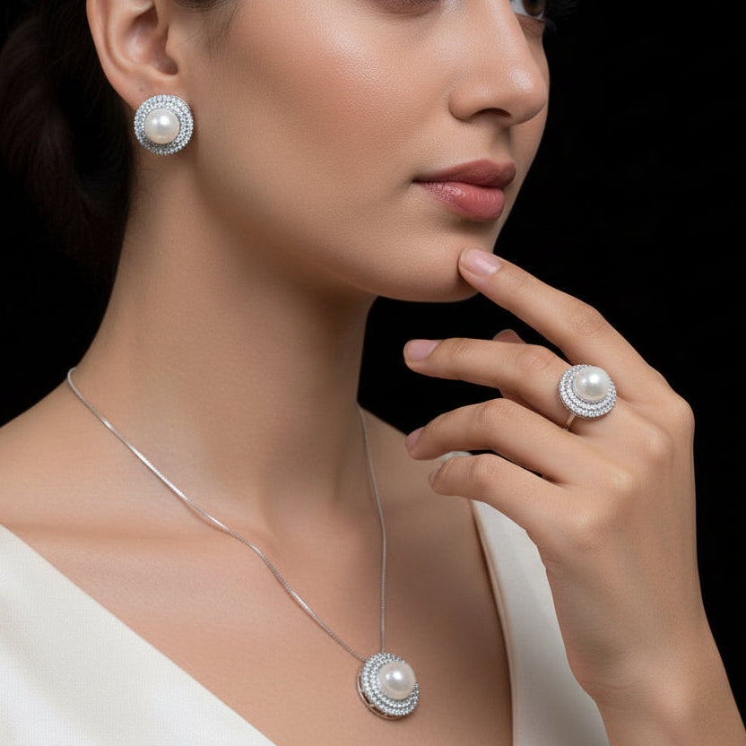 Pearl necklace and earrings set with 'Saheli' branding on a black background