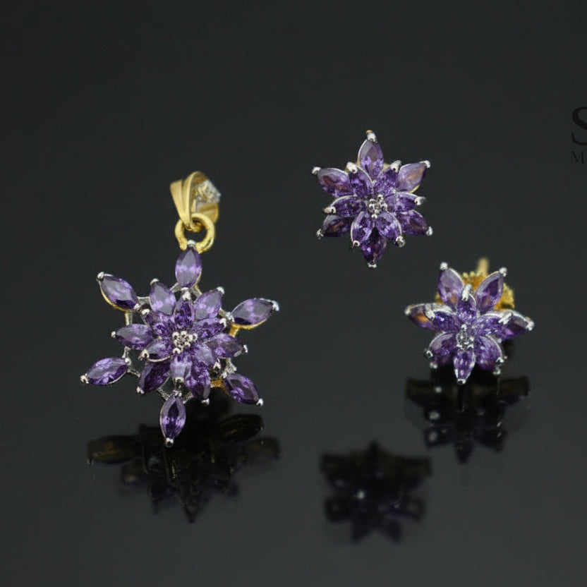 Purple floral jewelry set with gold accents on a dark background, branded 'Saheli'.