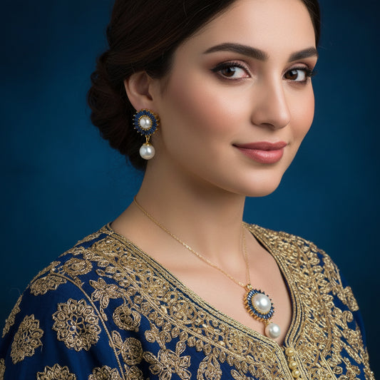 Pearl earrings with blue and gold accents on a dark background, branded 'Saheli'.