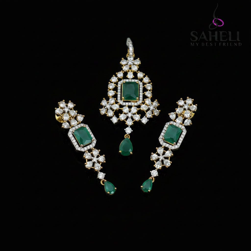 Ornate earrings with green gemstones and gold accents on a dark background, featuring the brand 'Saheli'.