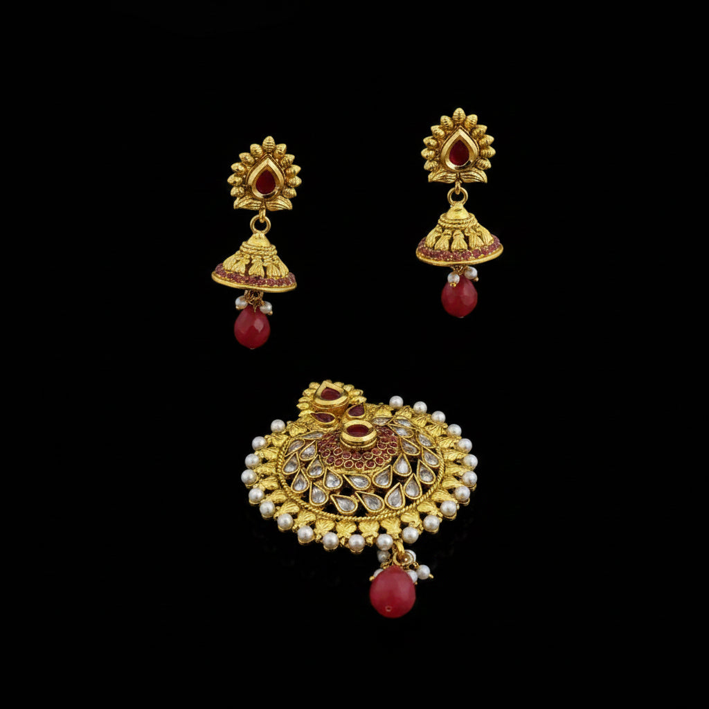 Gold earrings with red and pearl accents on a dark background, featuring the brand 'SAHELI'.